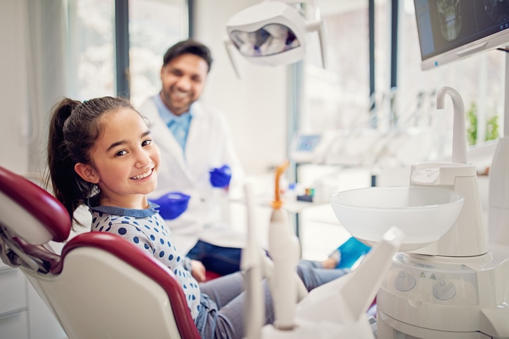 Portrait of girl and doctor in the dentist office